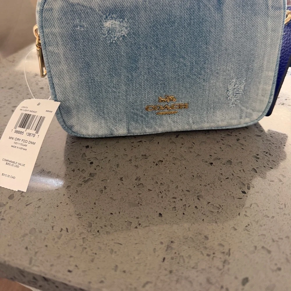 Coach Light Denim Crossbody with Purple Tag and Red Charm